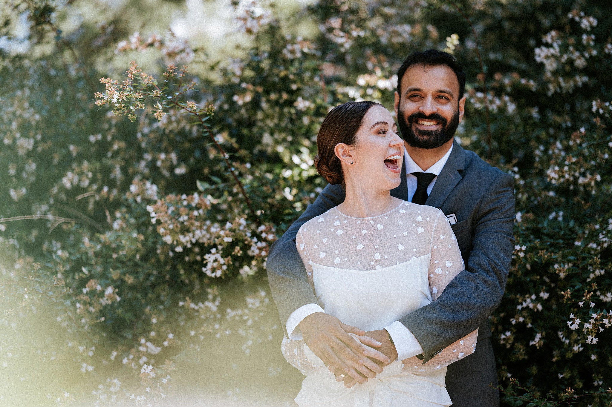 Photo of a bridal couple holding each other
