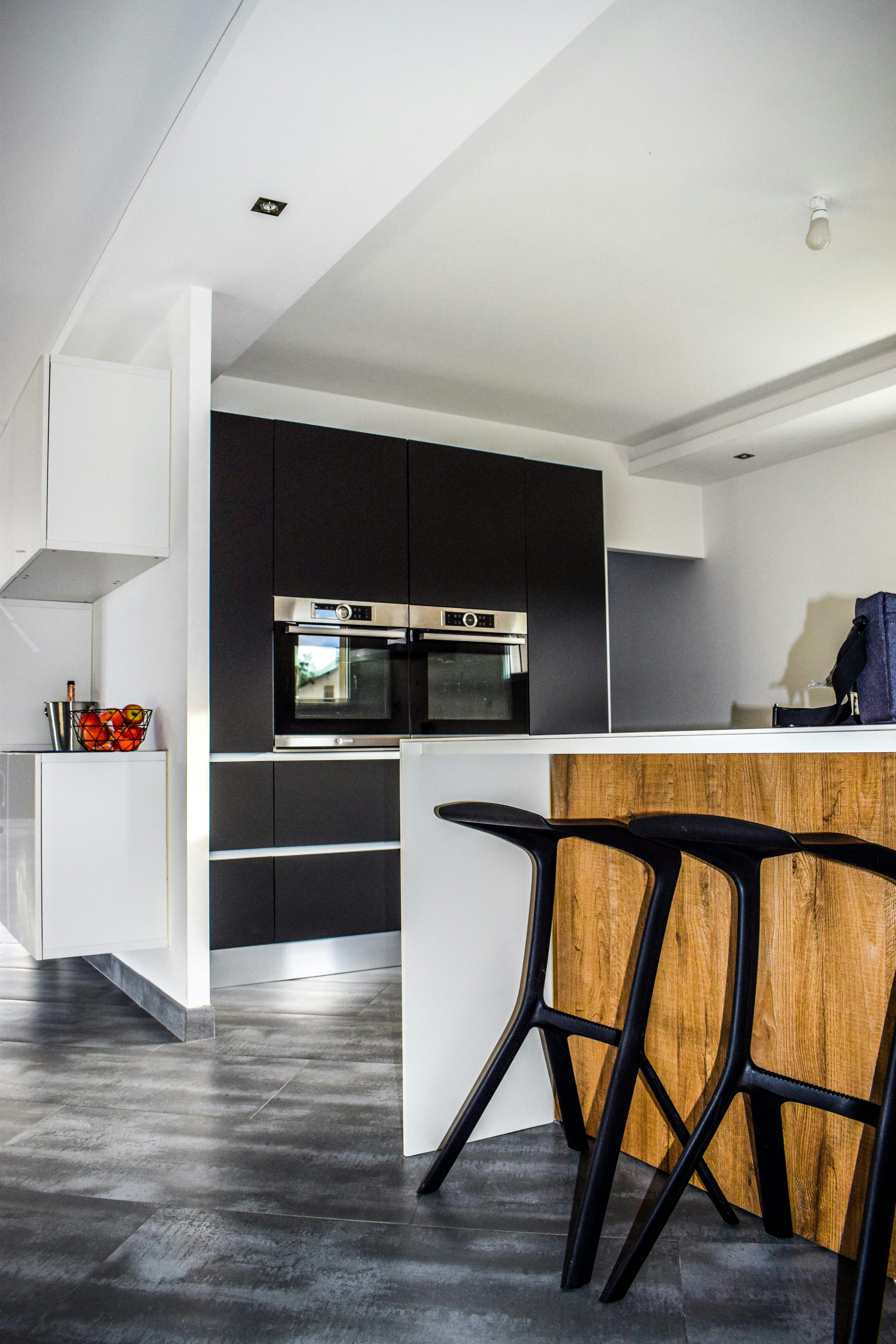 brown wooden kitchen cabinet and sink