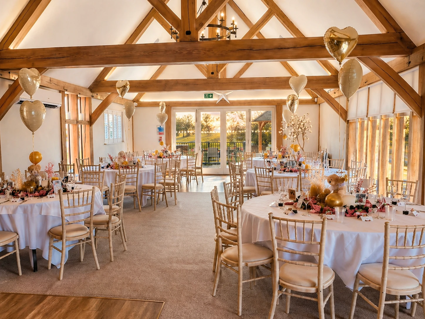 A charming rustic building with dark wood siding and a red-tiled roof houses "The Garden Room," 