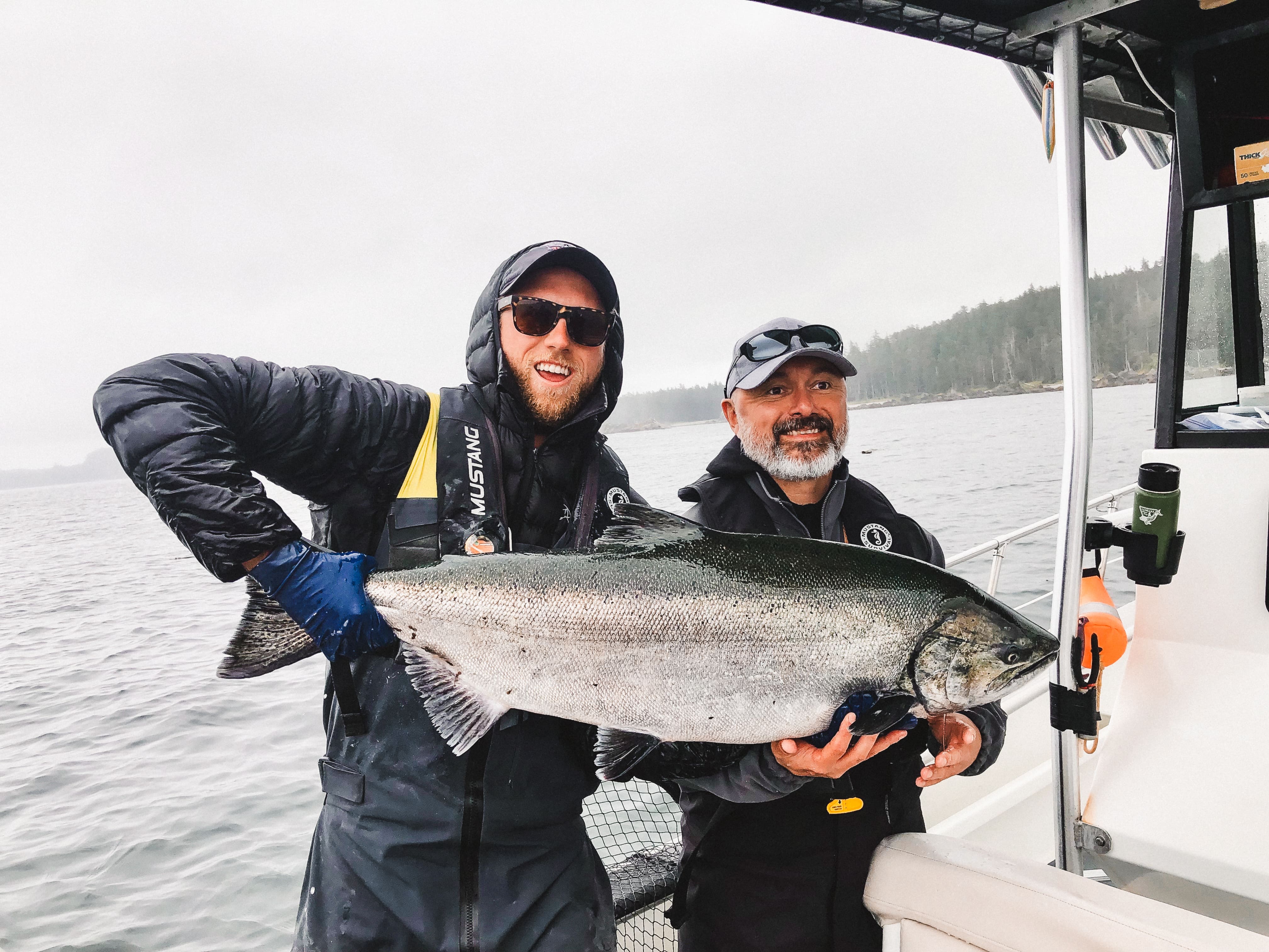 A bottle of daisy perfume with floral accents.