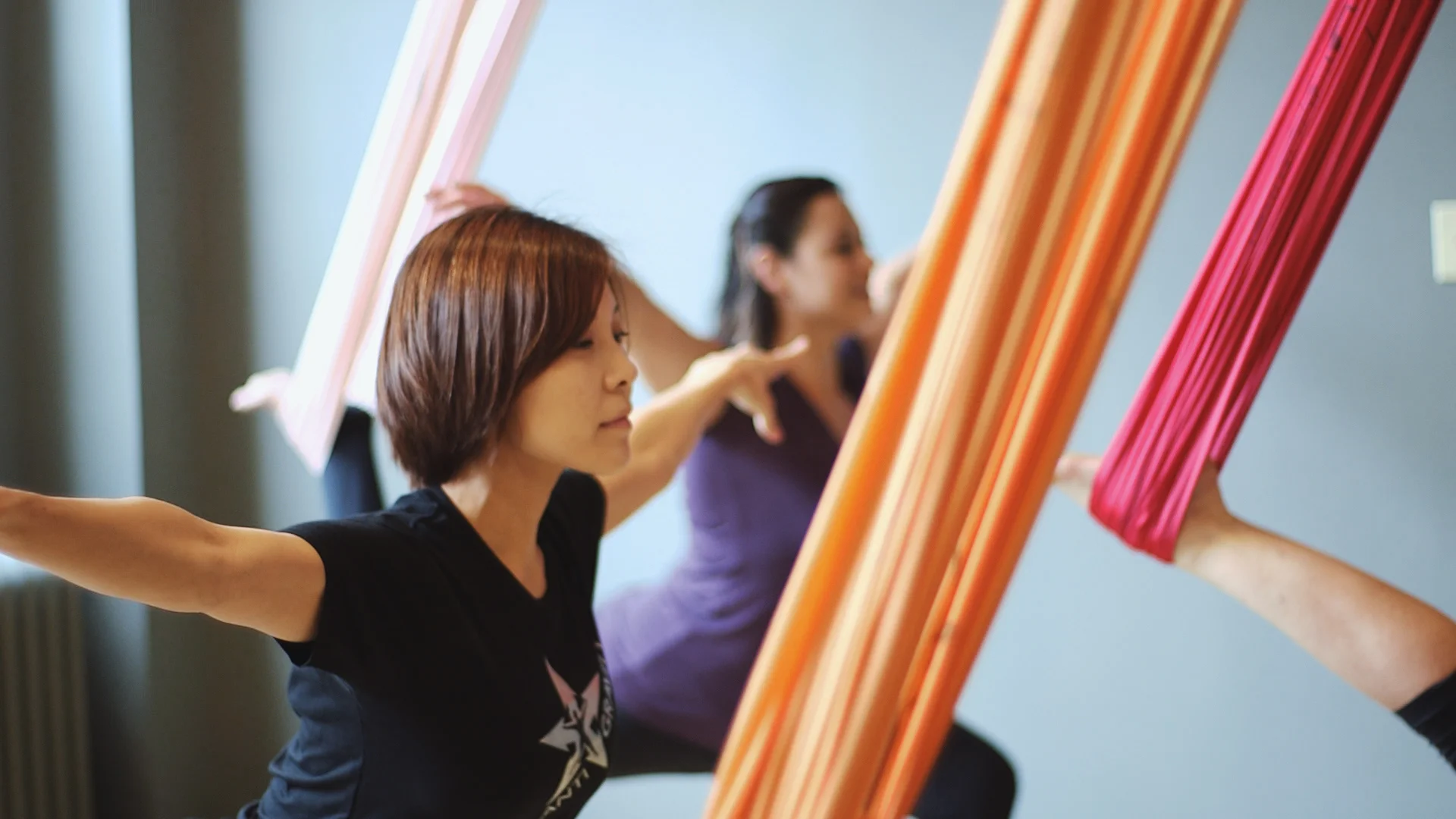a woman is doing a piyoma exercise in a gym