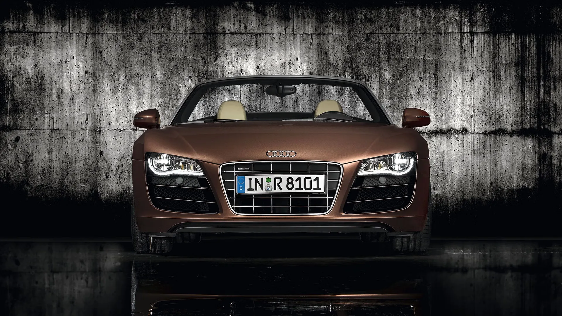 Bronze convertible supercar outdoors