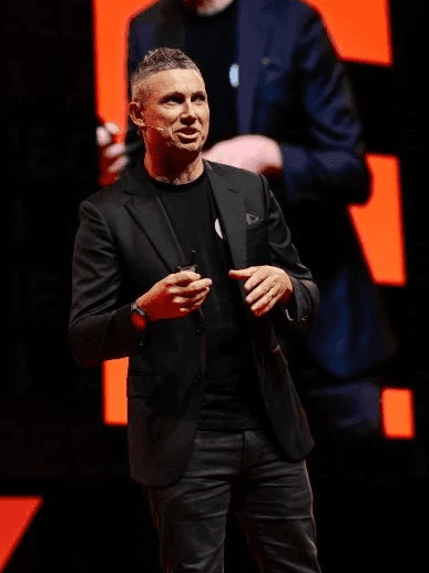 Chris Gilmour confidently giving a speech at a previous seminar