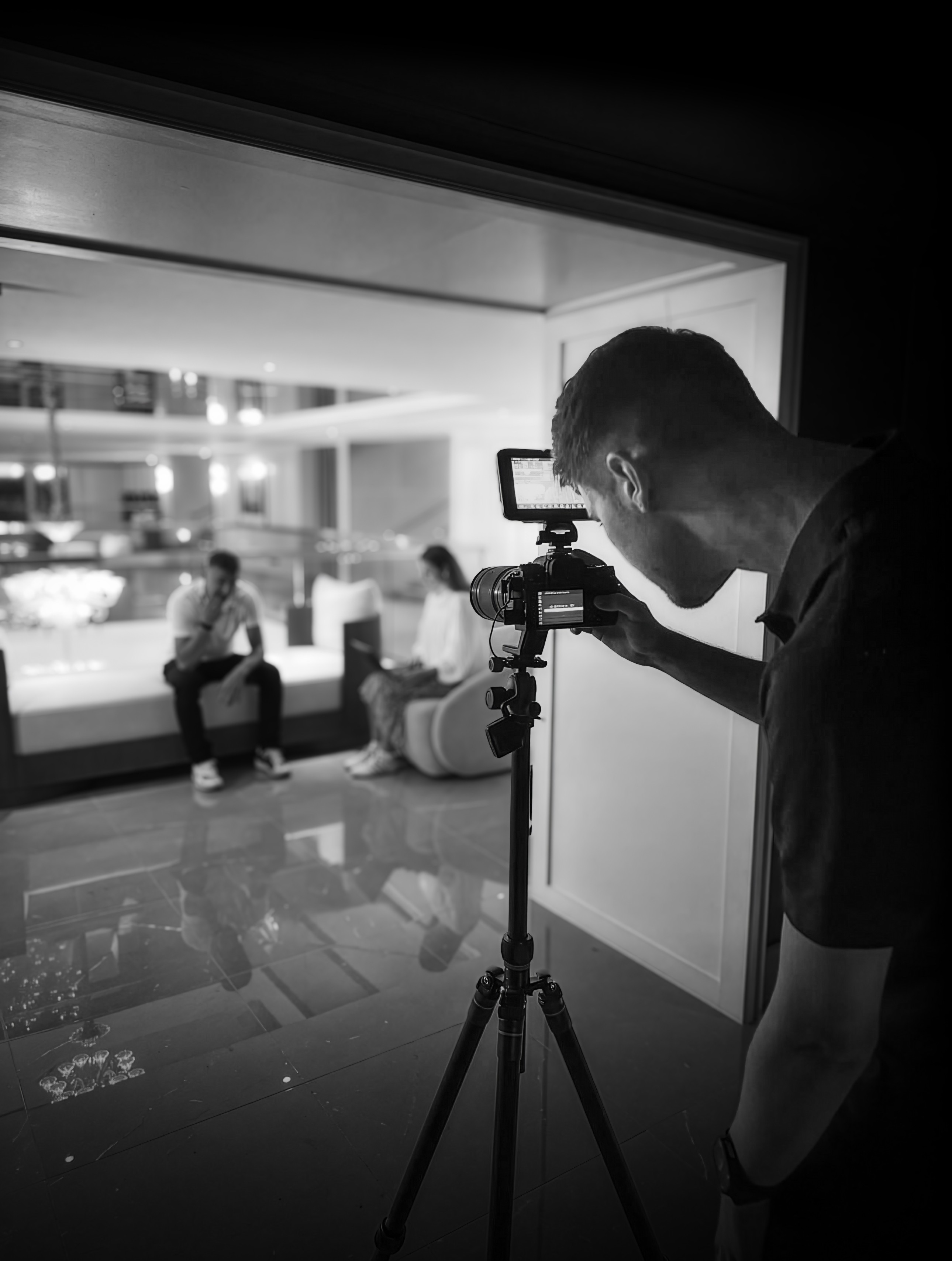 Alex Cleall filming an interview on location.
