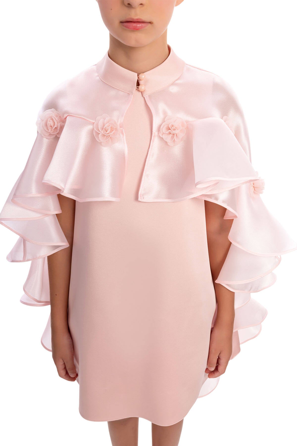 Pink dress with ruffled sleeves and floral details on a white background