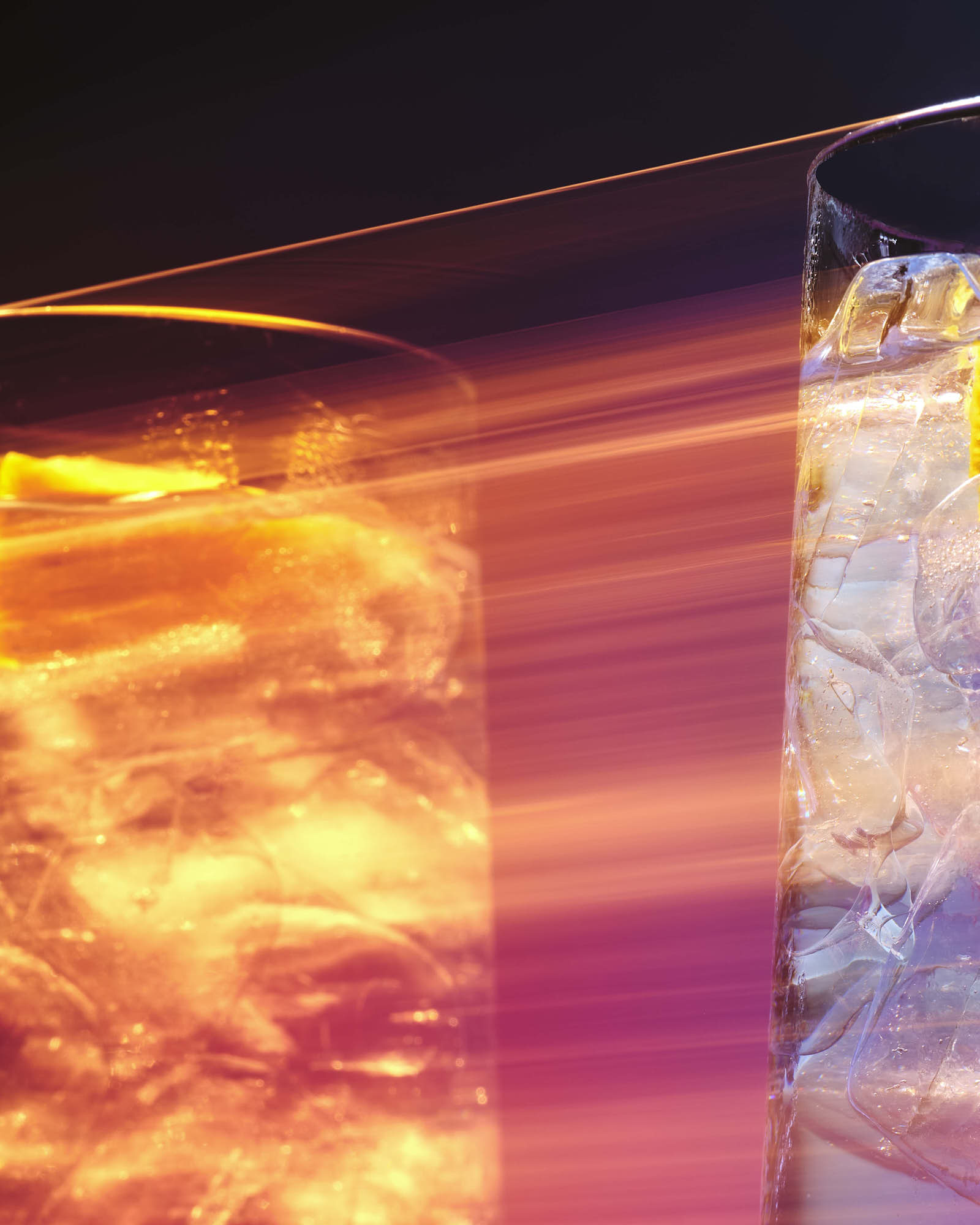 A close-up image showing swirling orange and yellow colors against a dark background, resembling molten lava or heat.