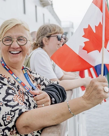 Woman holding the Canadian flag