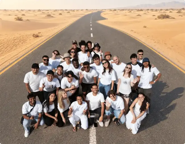 The Nas.com team posing together on a desert road