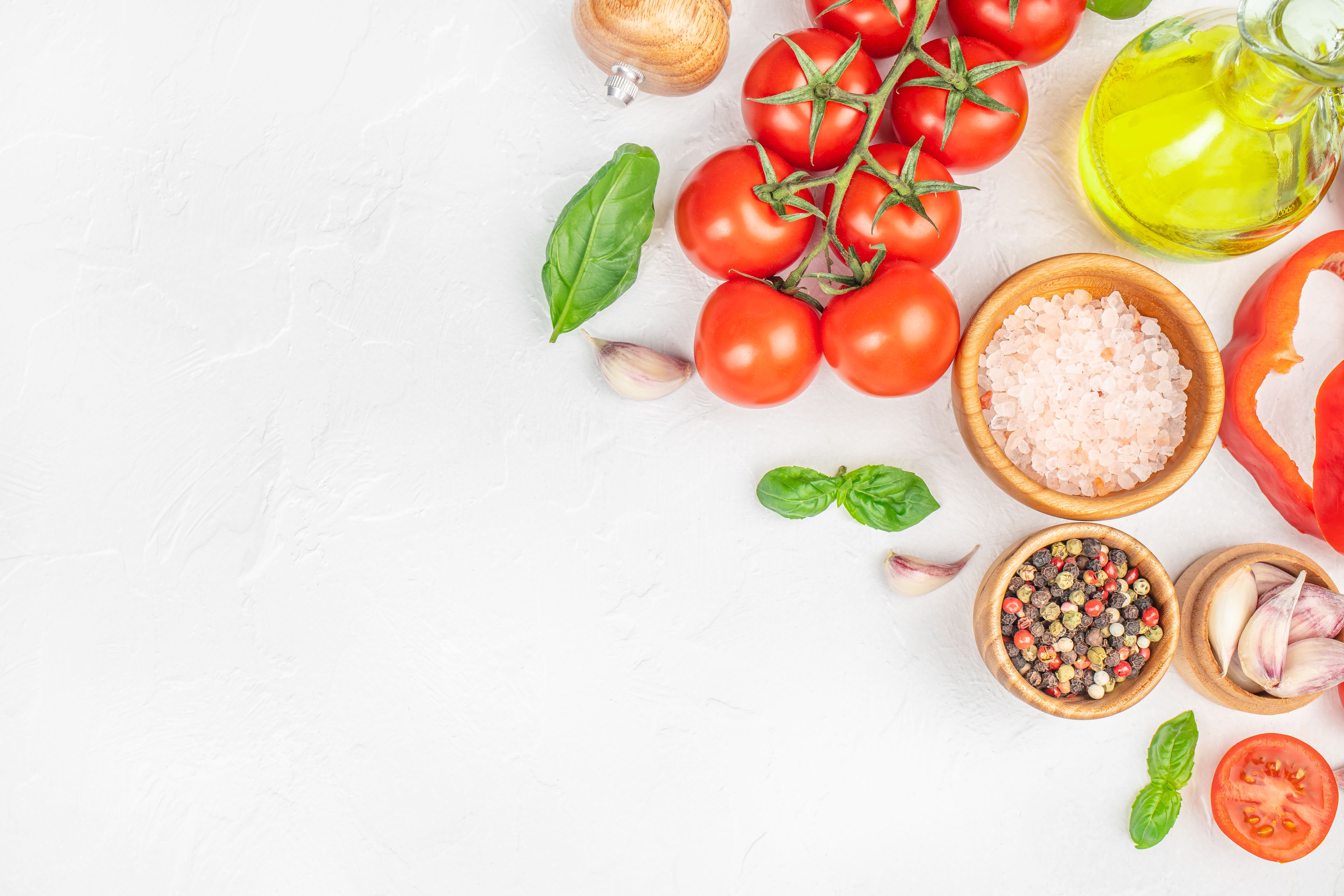 Fresh ingredients including tomatoes, garlic, herbs, spices, and oil