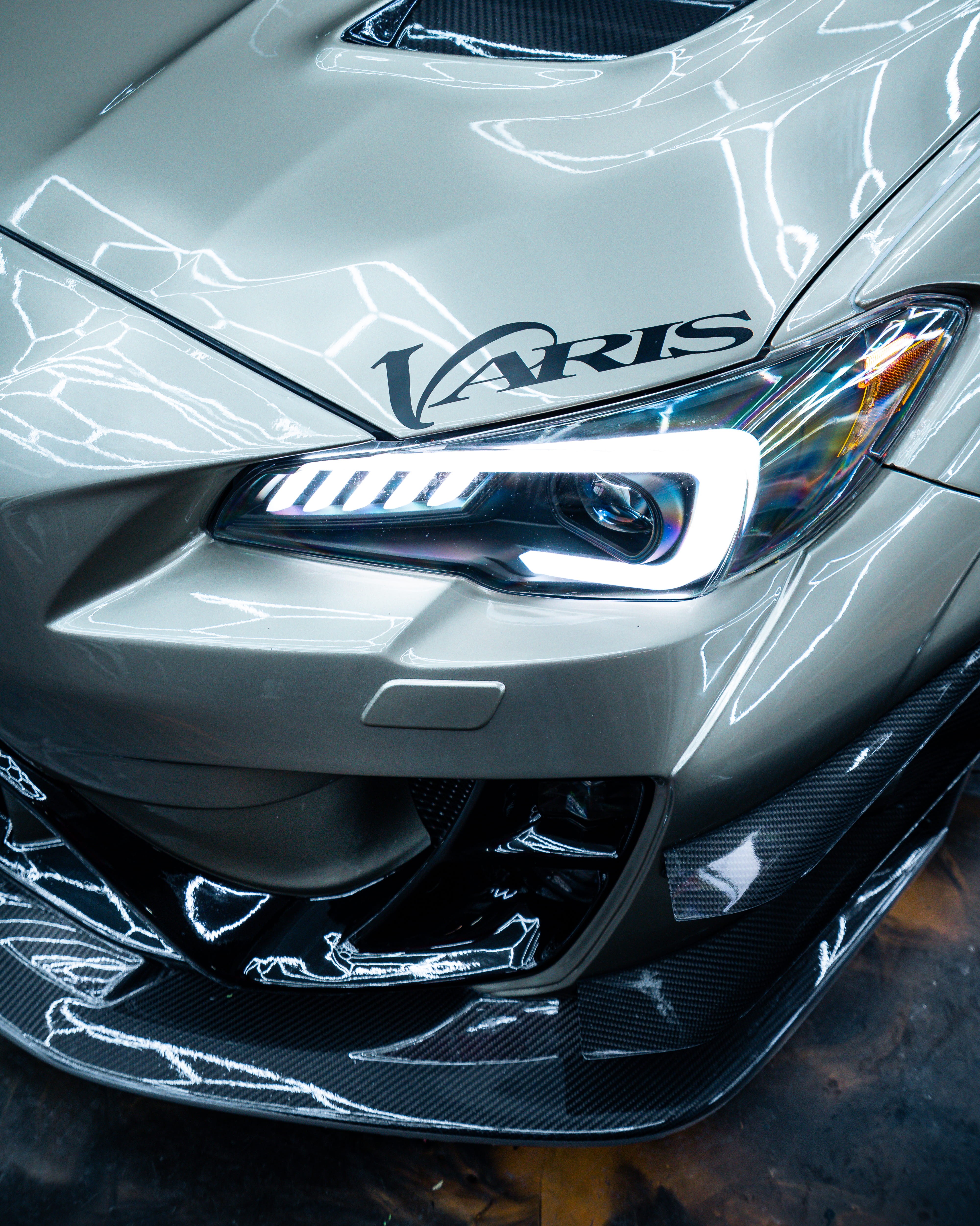 Headlight detail on a sage green Subaru WRX STI with Icon Rocklear permanent paint protection, Dragon Auto Milpitas