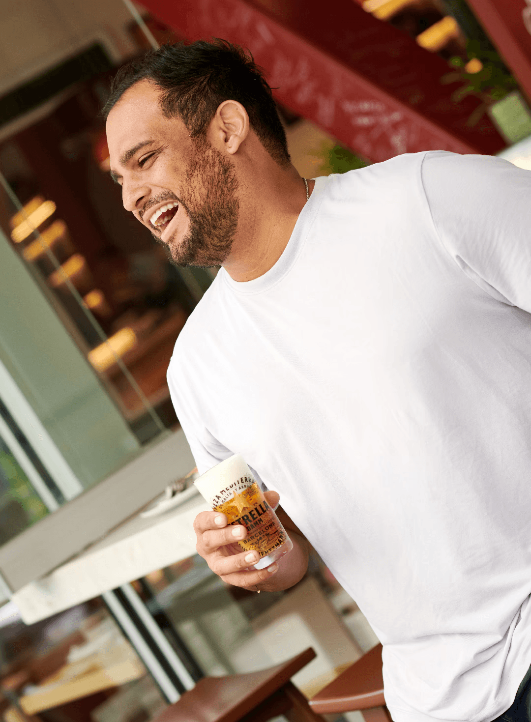 two women talking while holding drinking glasses