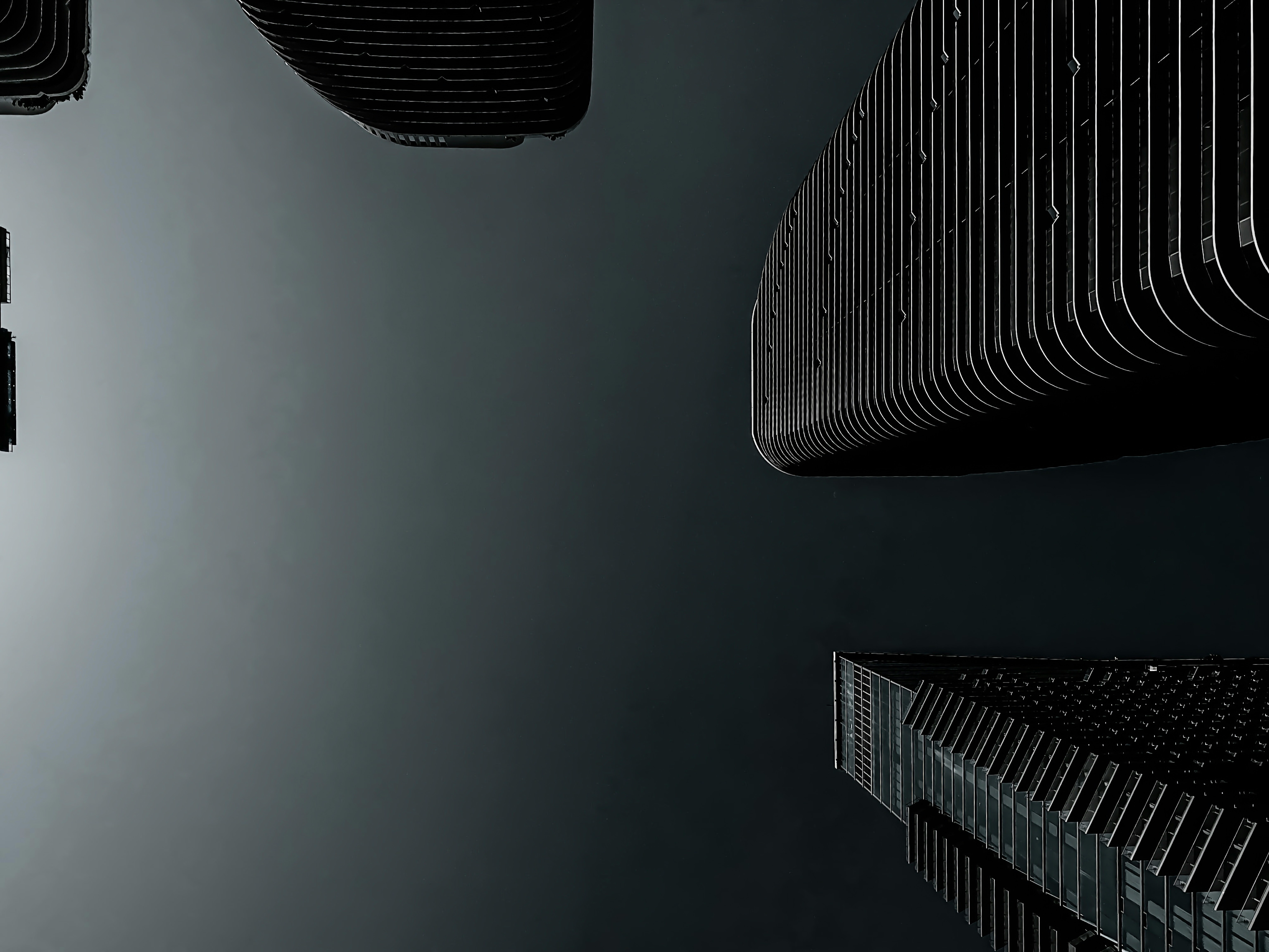 a black and white photo of a group of skyscrapers