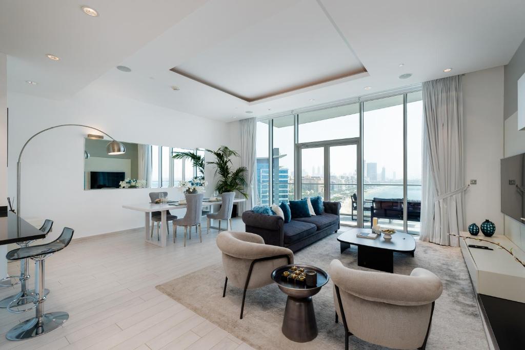 A well-appointed living room with a large bed and a window, reflecting the modern aesthetic of Oceana Residences.