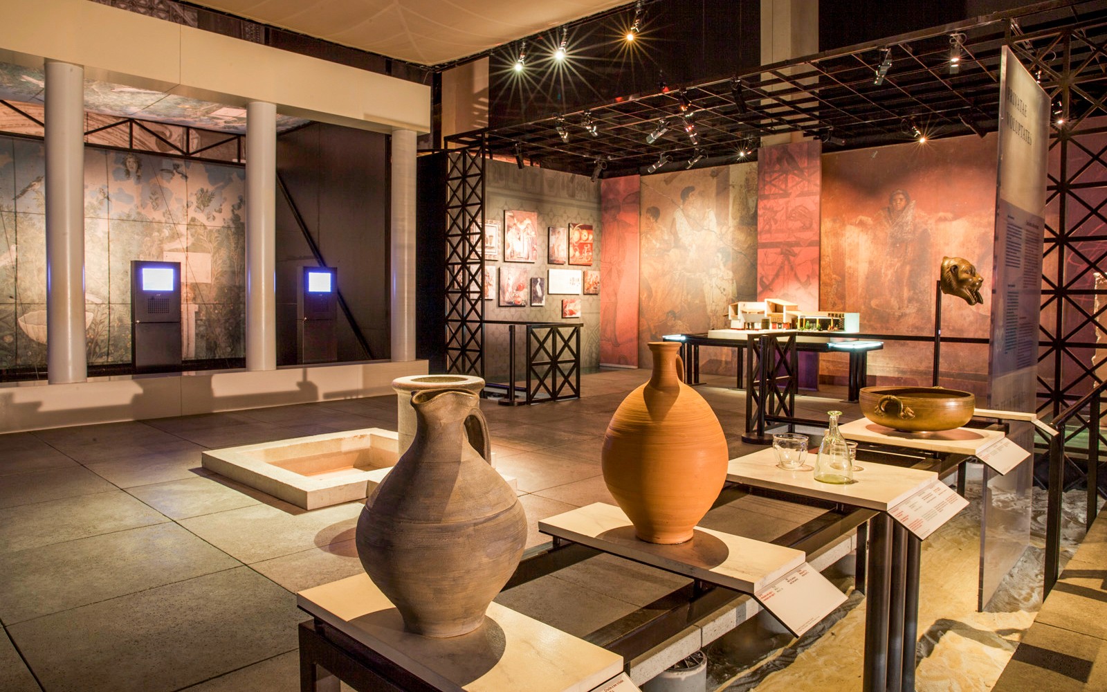 Museum exhibit with ancient pottery and artifacts at Pont du Gard, France.