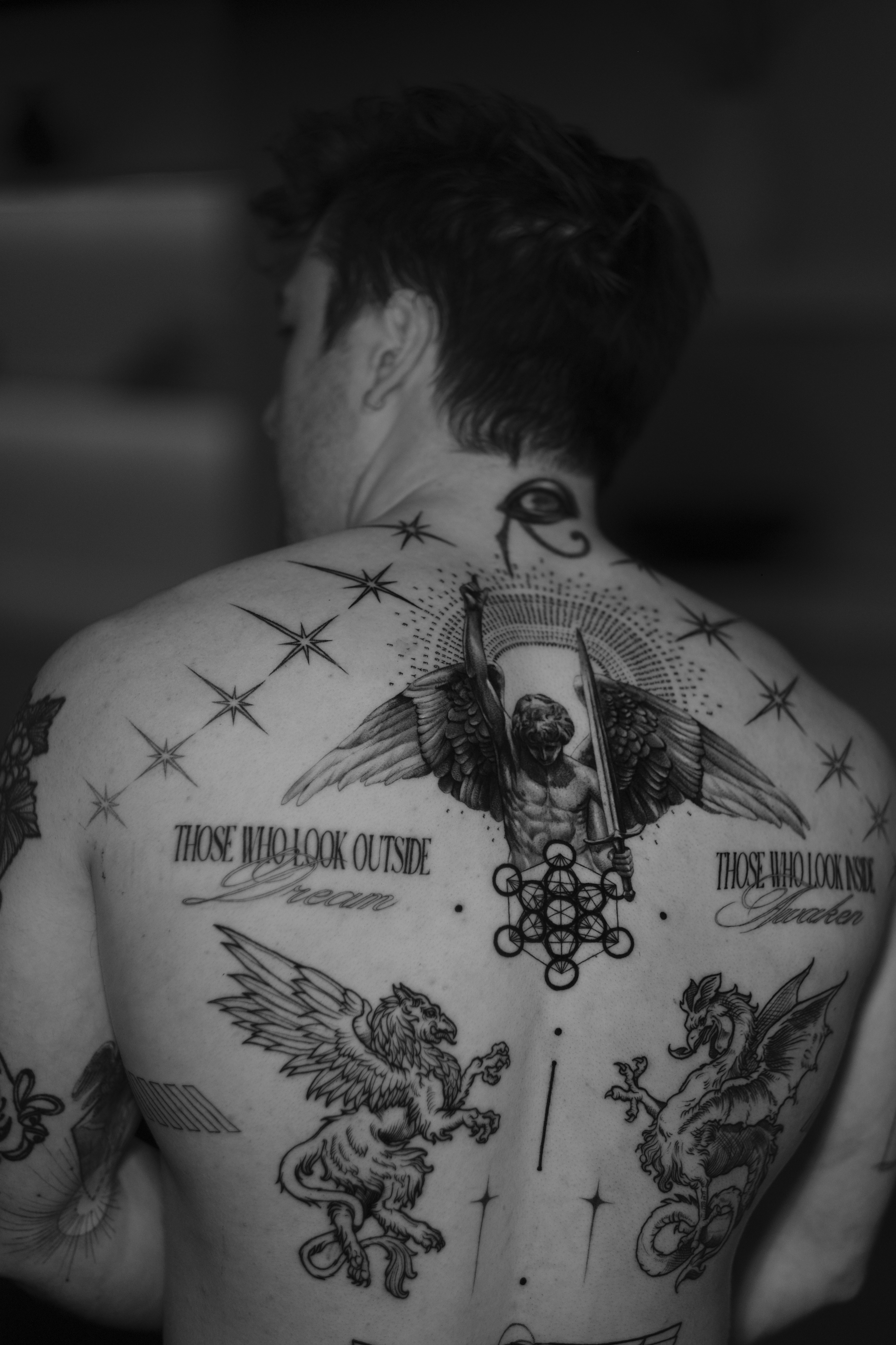 Museum visitors observing Renaissance paintings in a gallery