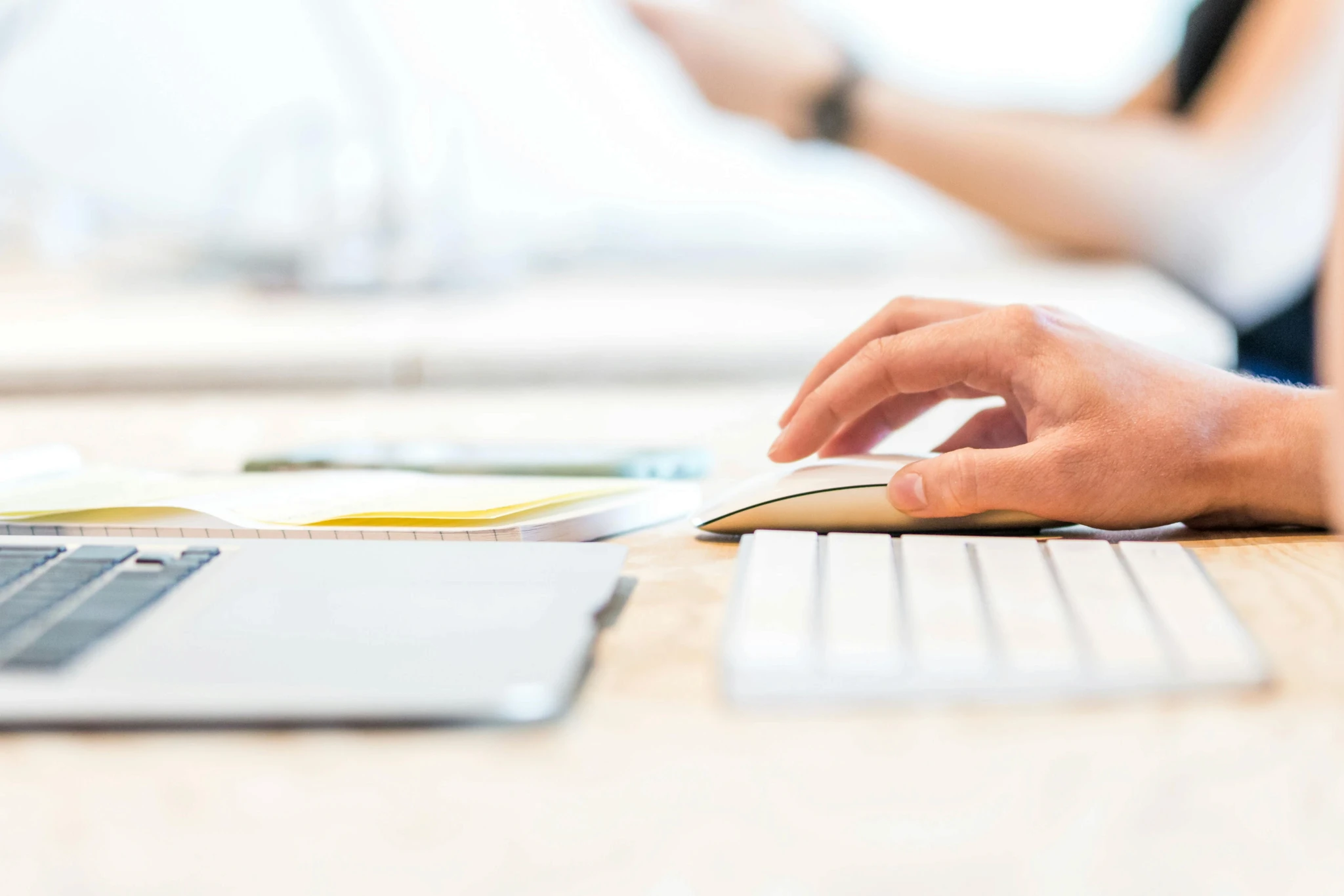 Person working on laptop with wireless mouse and keyboard – RJP.design, Web Design Agency NYC specializing in website design, SEO optimization, and digital marketing services.