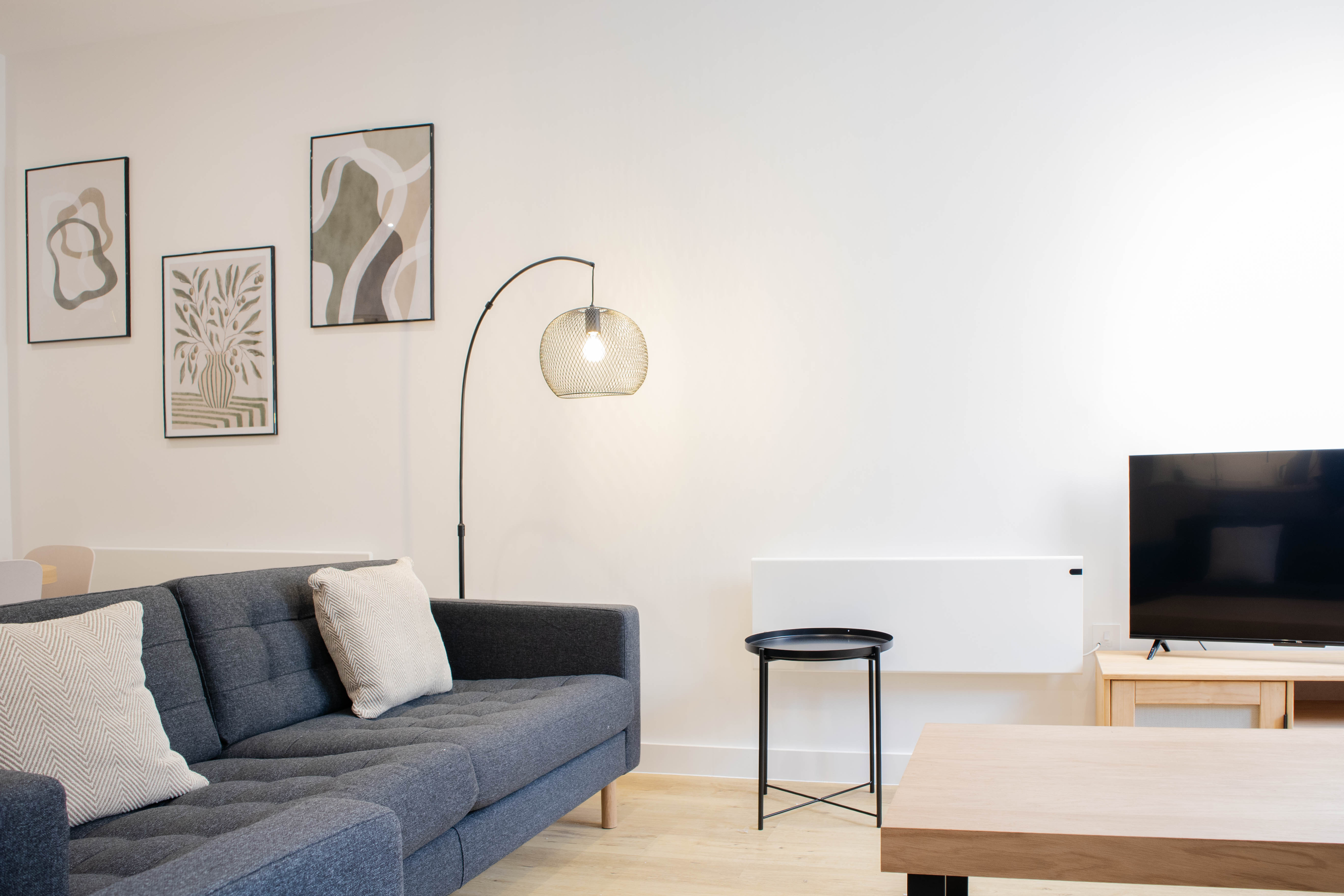 Modern minimalist Airbnb living roomwith neutral tones