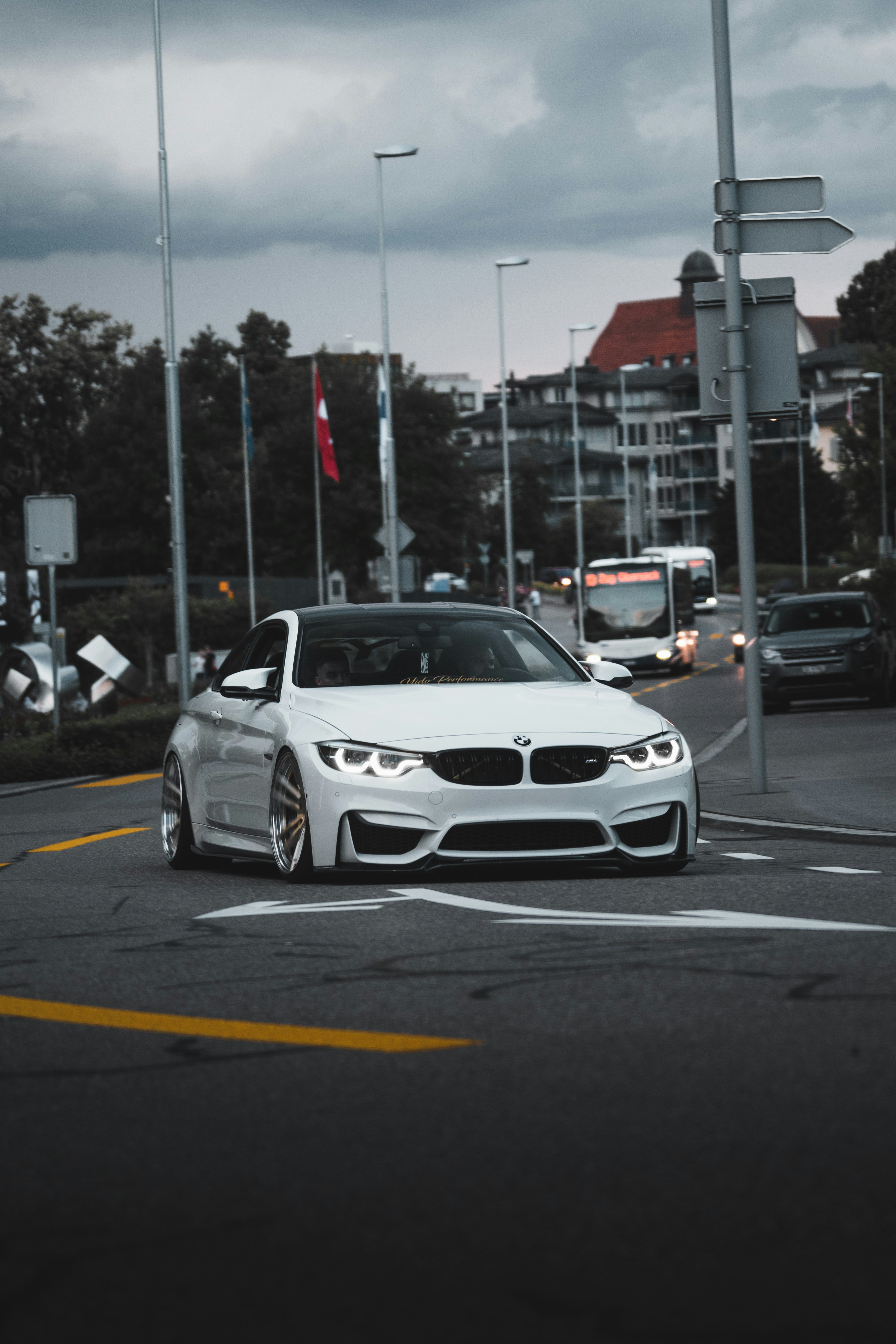 White performance coupe on a city street