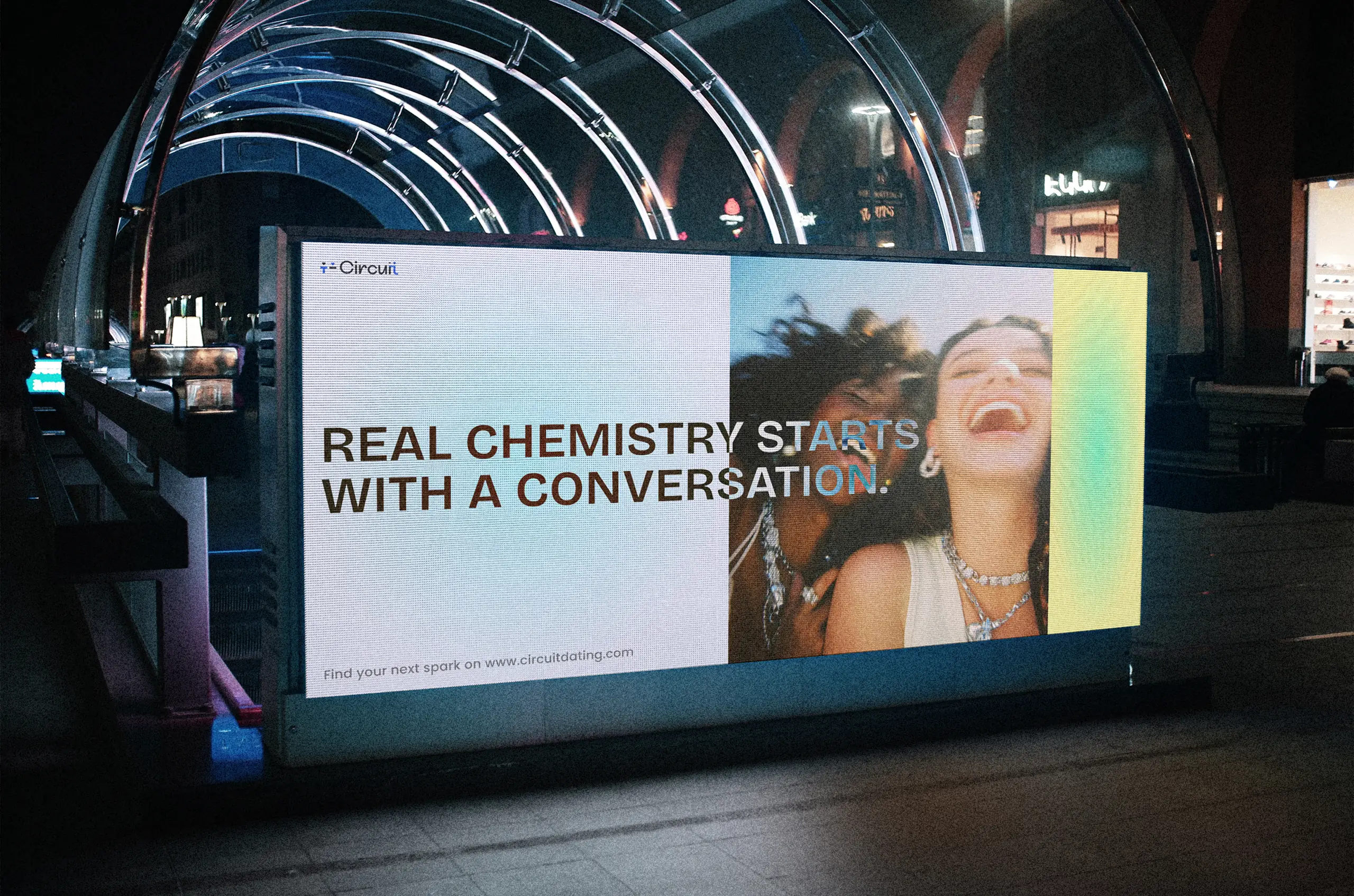 Subway billboard featuring Circuit’s dating platform message with two friends smiling.