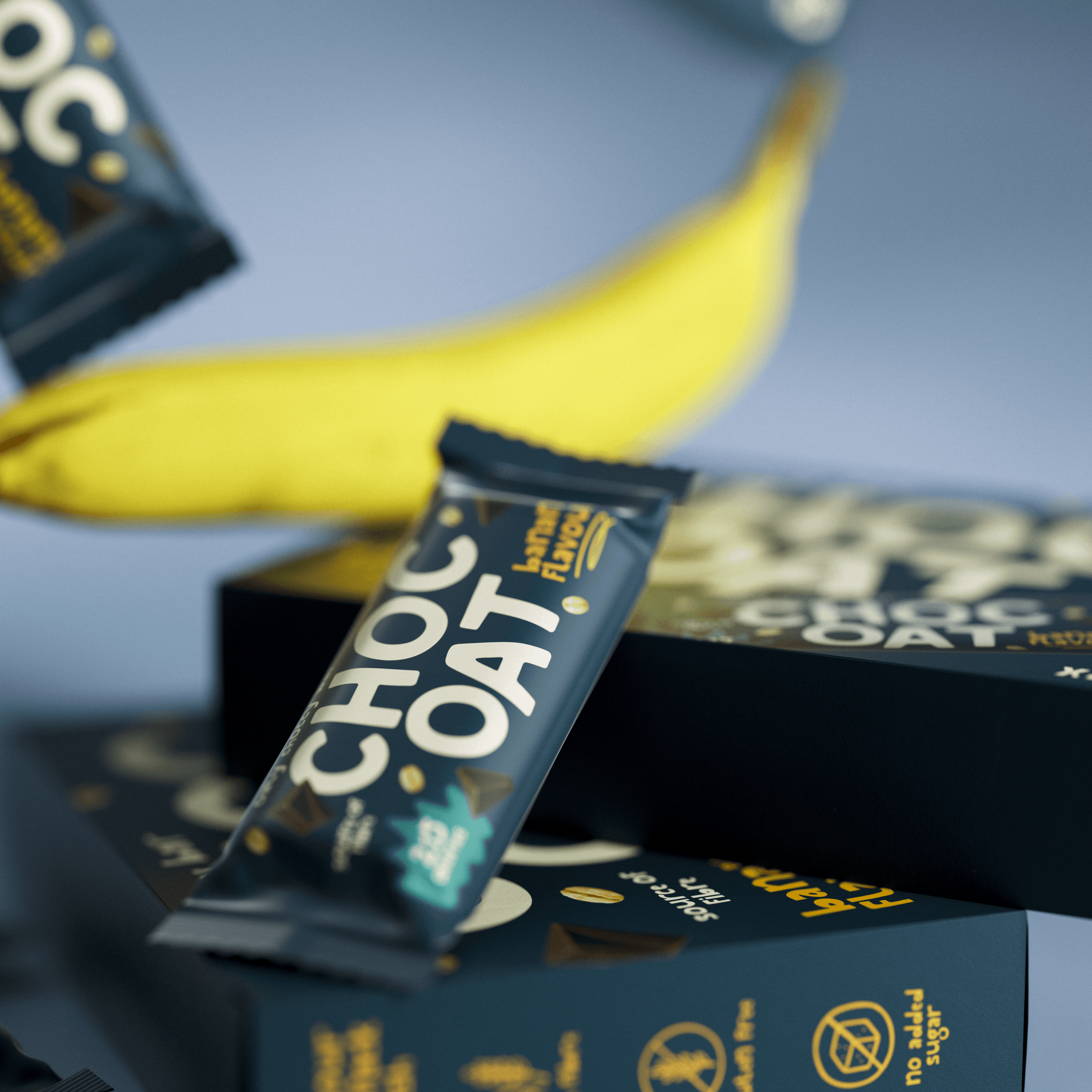 A young person with curly hair smiles at the camera while sitting in front of a laptop against a dark background.
