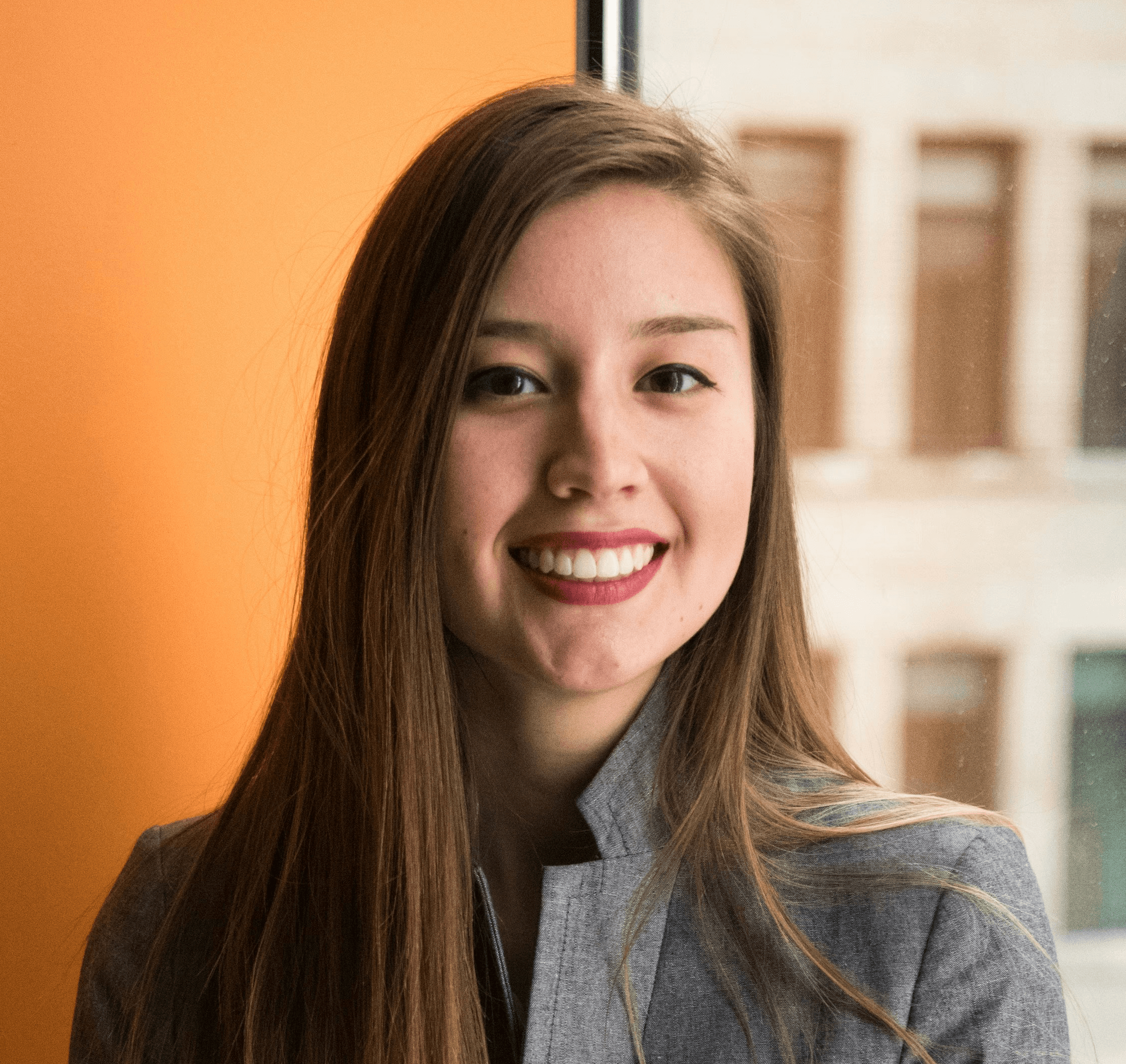 shallow focus photo of woman in gray jacket