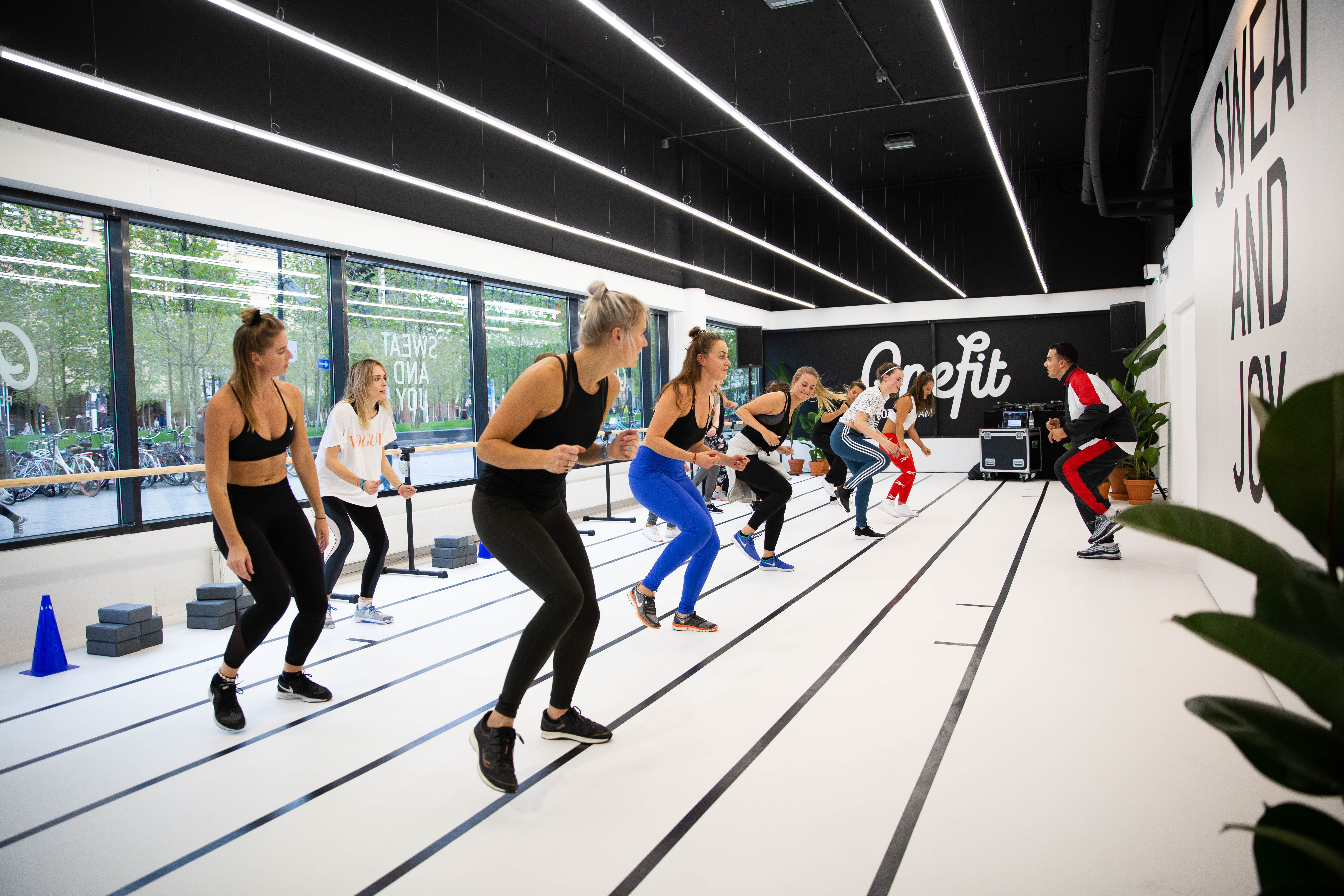 Photo of people doing a workout inside the Popup Gym in Rotterdam, while being filmed