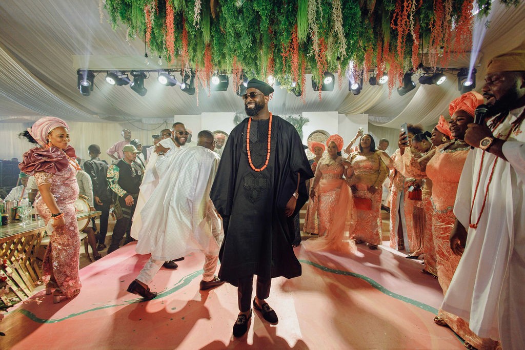 Bride and groom celebrating a luxury wedding coordinated by Victoria Brooks Events, a premium wedding planner in Nigeria. with family and friends