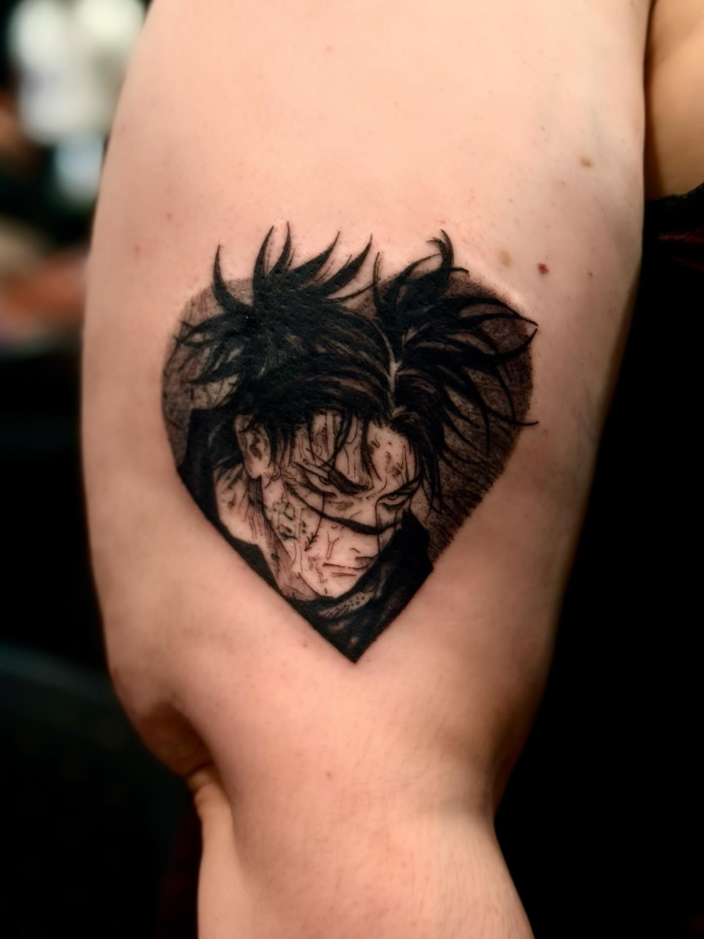 A forearm tattoo of Nezuko Kamado from Demon Slayer, depicted in a stylized anime art style. She is holding a sword.