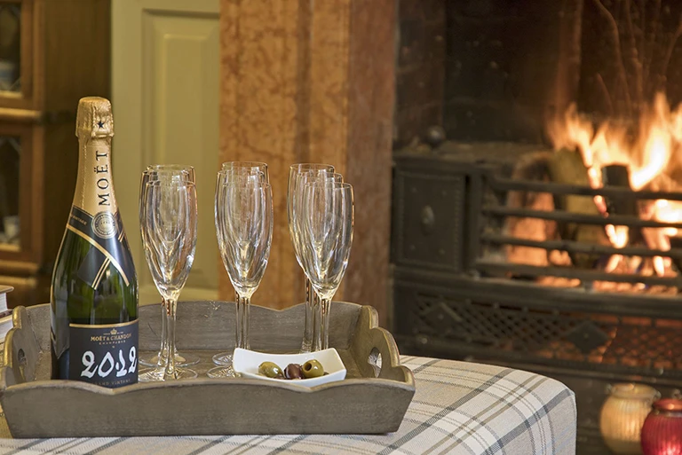 Hartingtons Heritage Tours hotel, Darley House, Sitting room with fire place and champagne