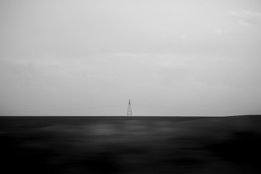 Cliffs next to a beach with a blue glowing moon