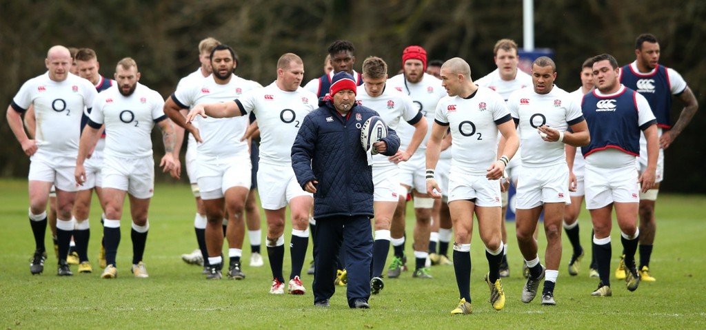 rugby coach with his squad
