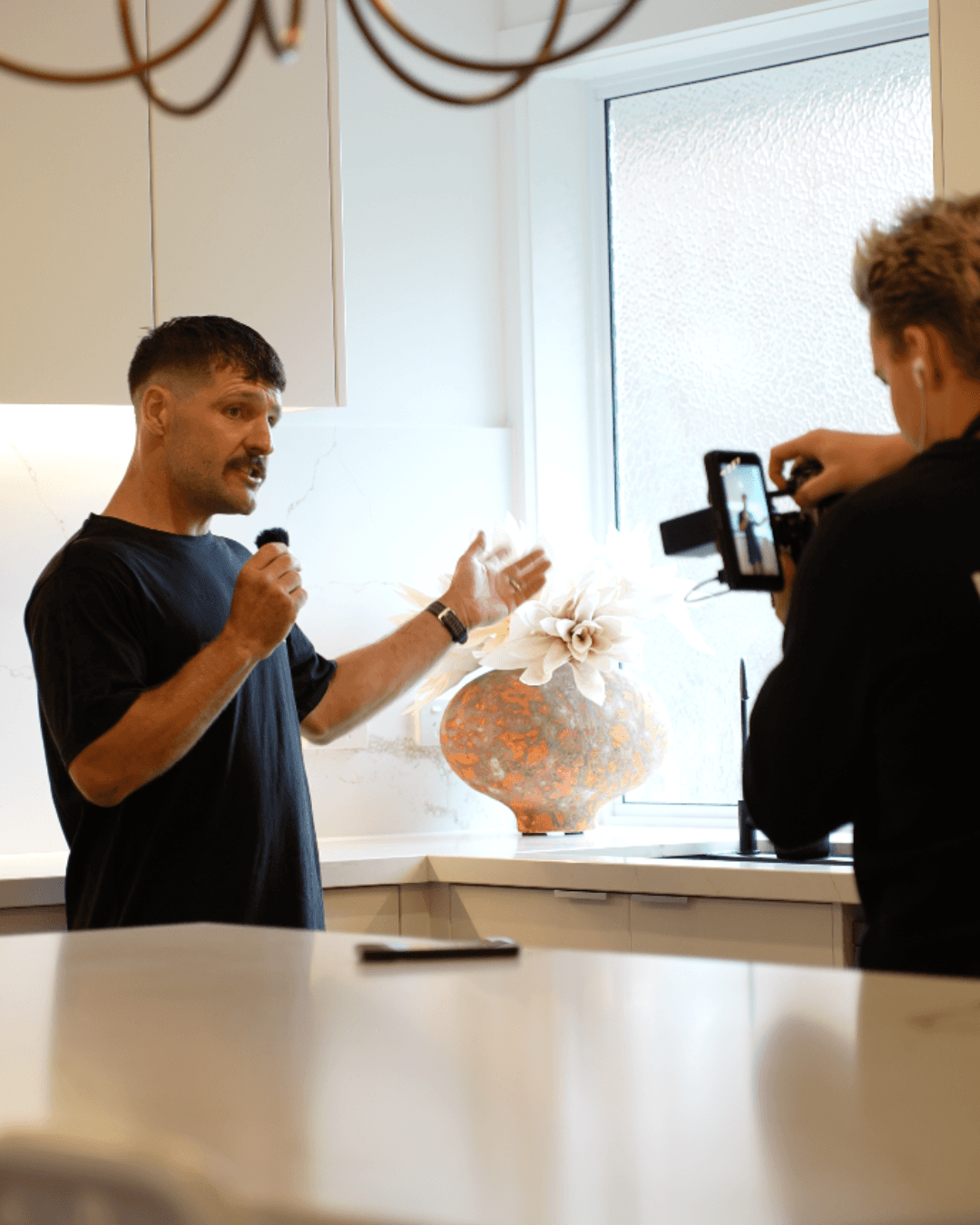 Framer Studio promotional page featuring stacked devices and neon graphics.