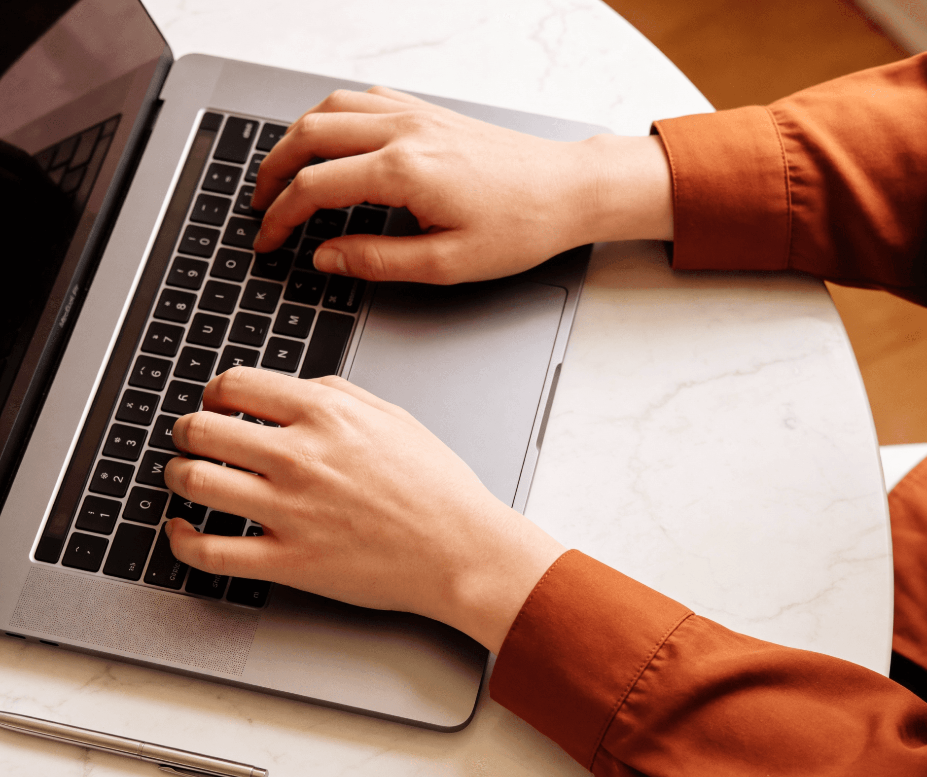 Person writing content strategy on a laptop