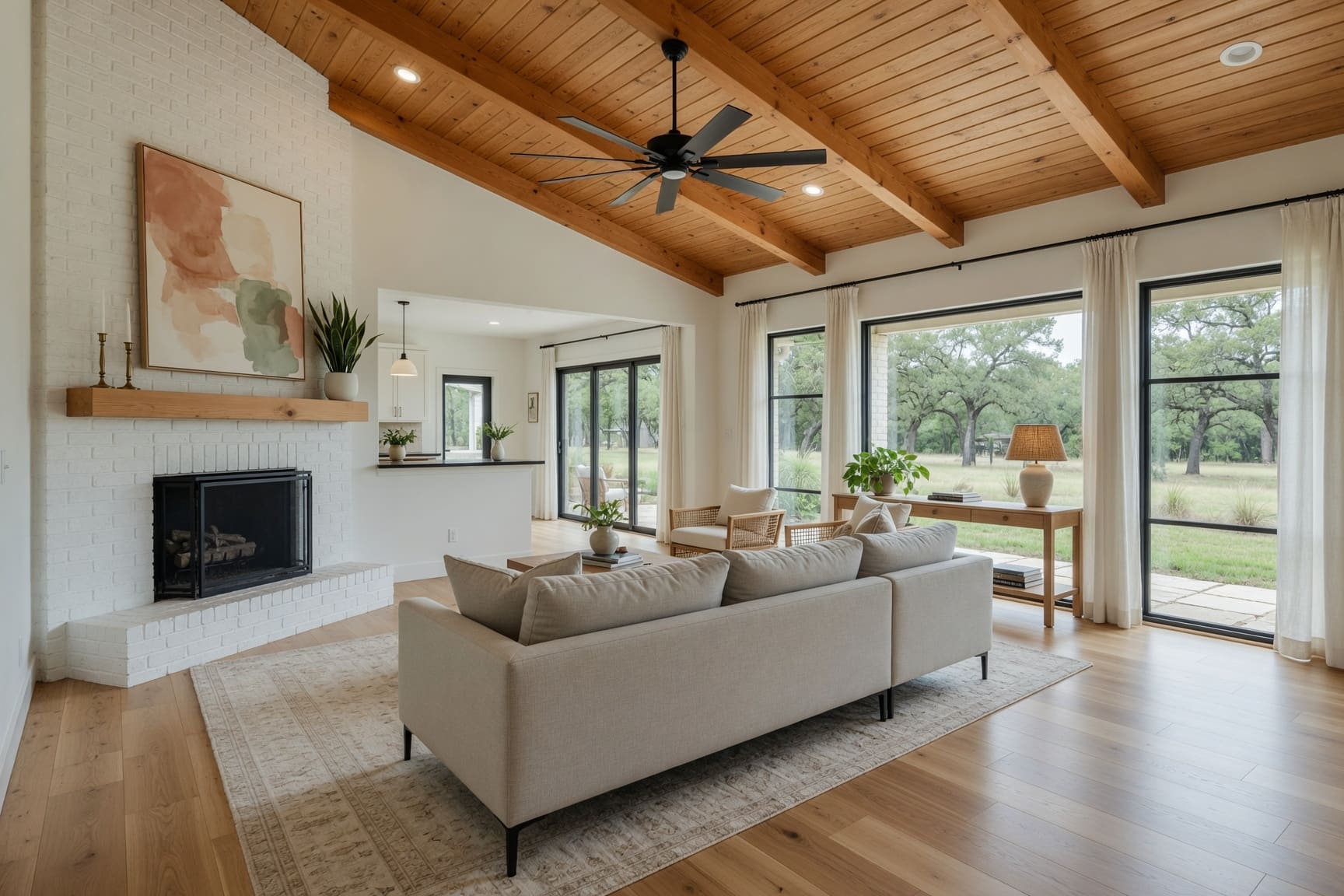 Open plan living room with vaulted wood beam ceiling