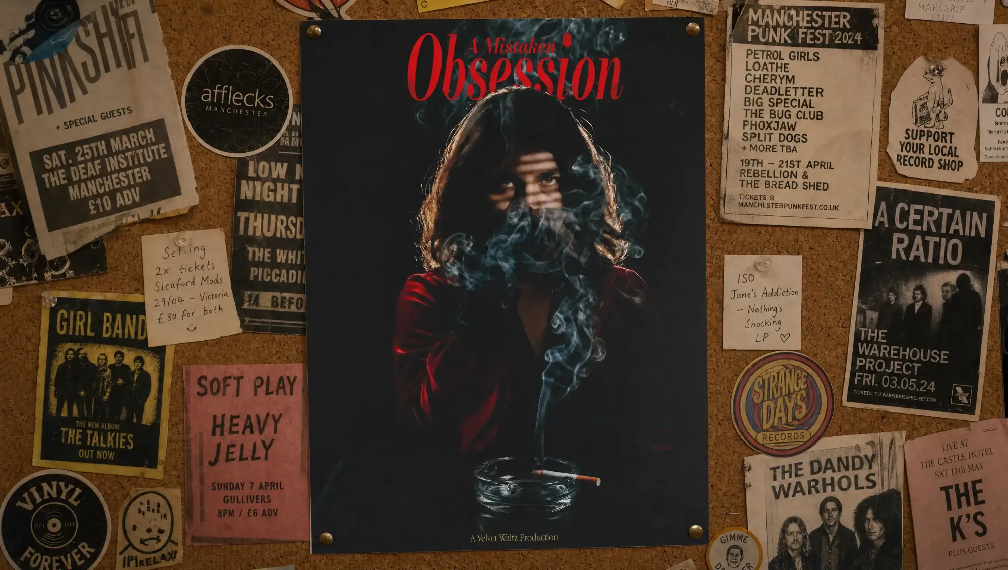 A Mistaken Obsession poster pinned among gig flyers on a corkboard