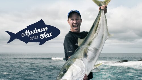 Madman of the Sea image of fisherman holding giant fish by the tail and showing to camera.