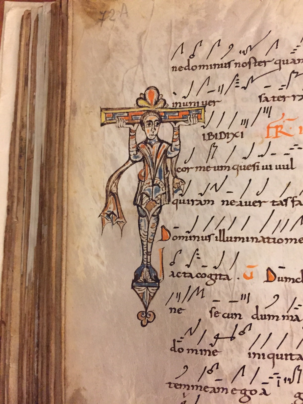 Calligraphic writing and stylized drawing of a lady from an old book.