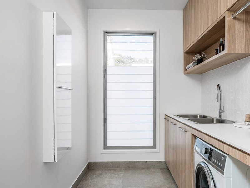 luxury laundry in a new build painted by omar garrett filho