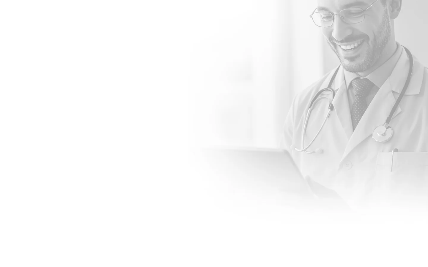 Doctor smiling while reading a digital tablet, wearing a stethoscope.