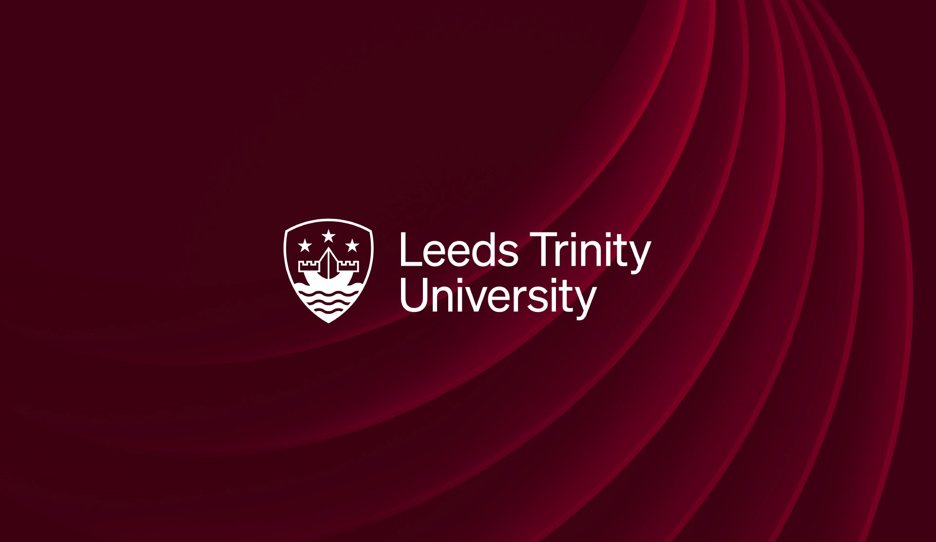 Modern commercial space with a slanted roof, surrounded by greenery and a spacious outdoor area.