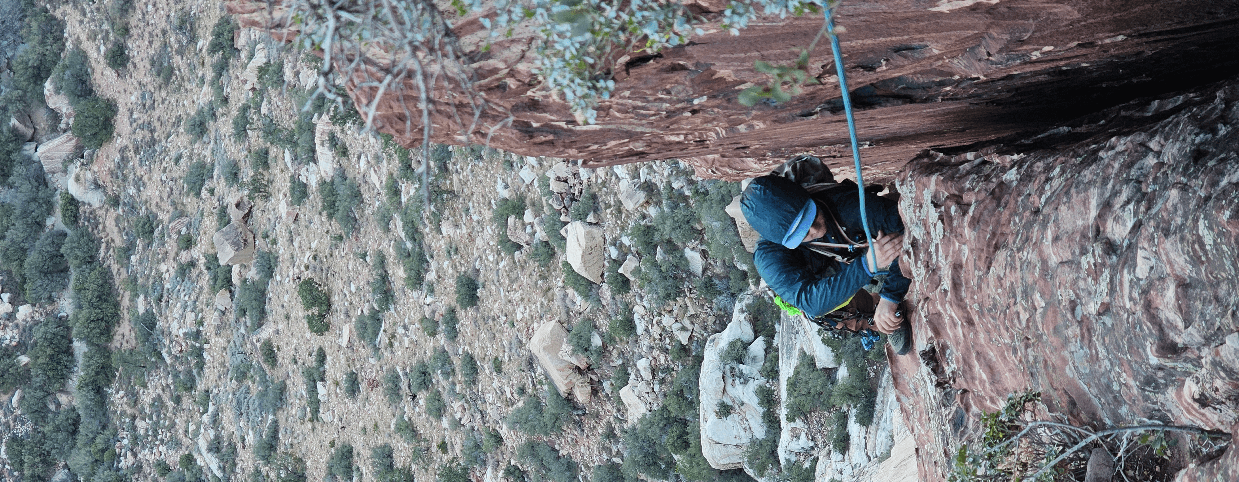 Climber in the shade on a day in red rocks