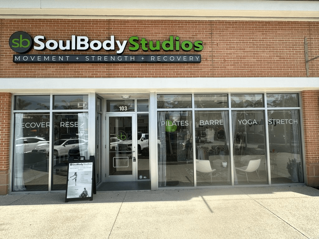 a woman is doing a piyoma exercise in a gym