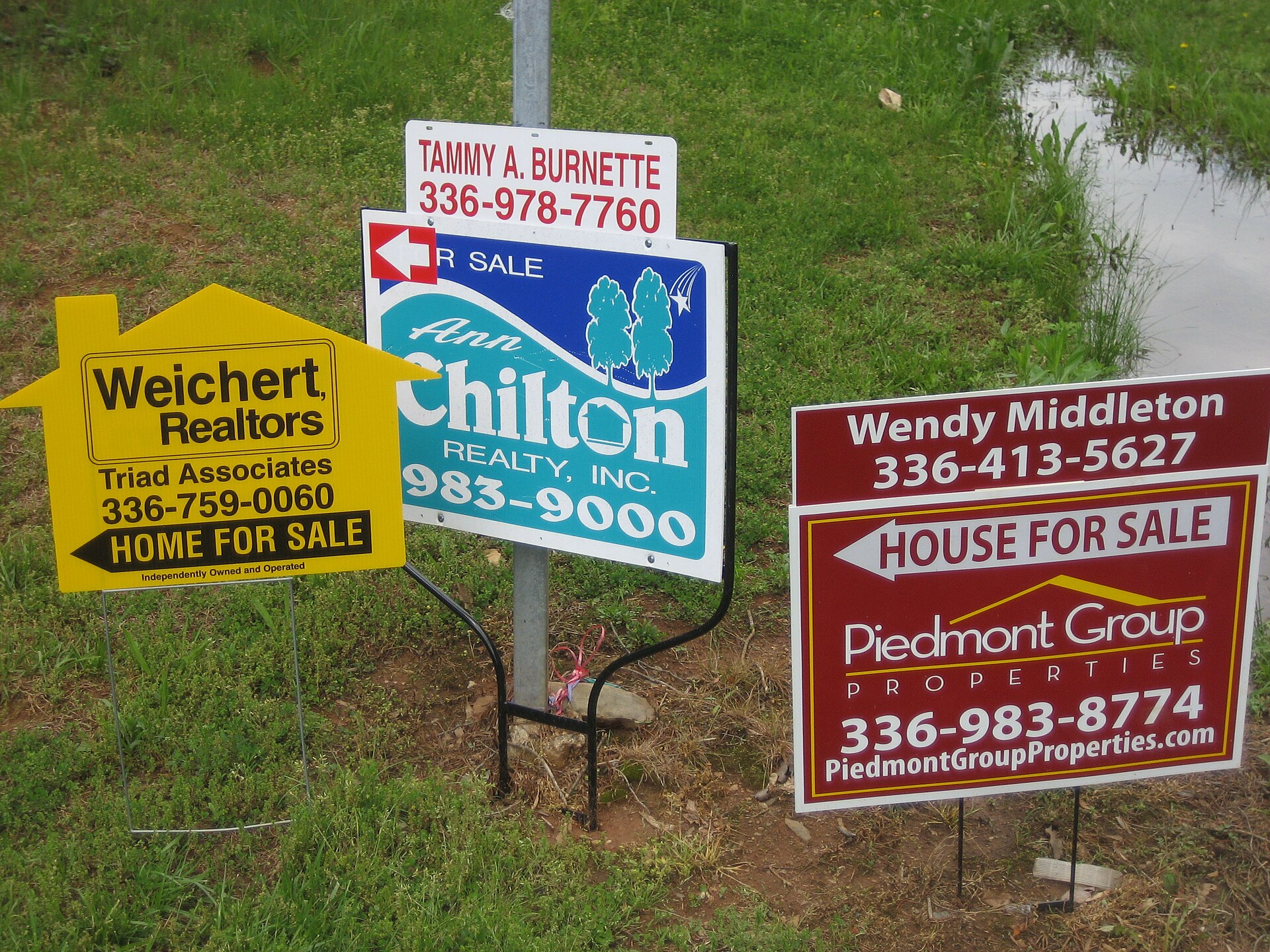 Real estate listings and for-sale signage