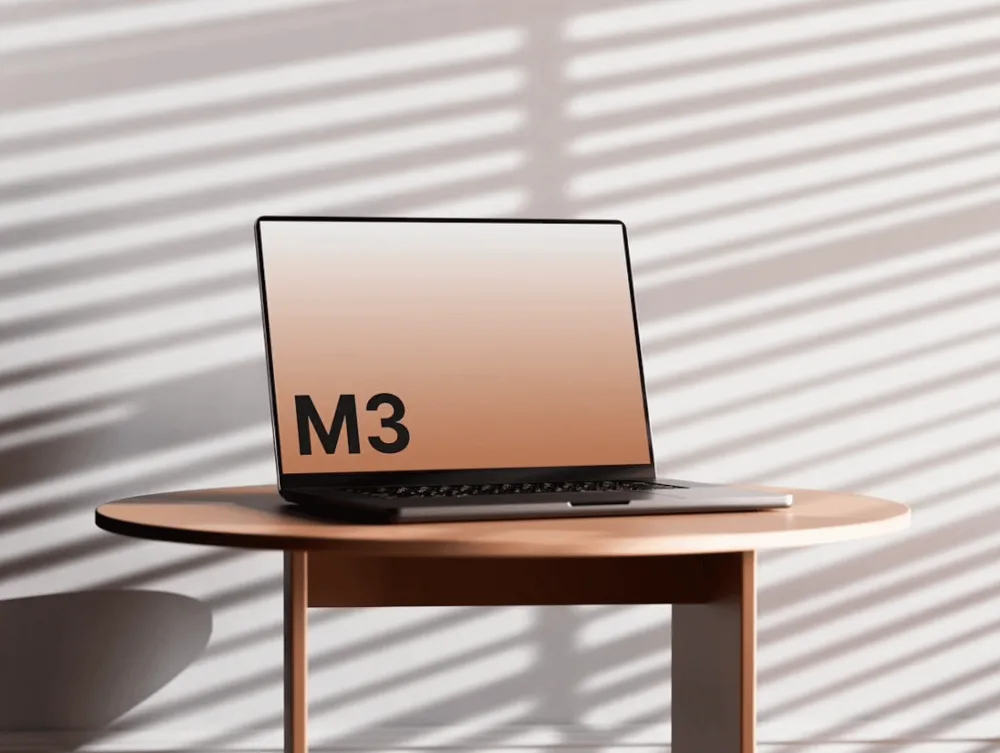 Mockup of a sleek MacBook placed on a round wooden table, displaying a gradient screen with a placeholder. Soft shadows and diagonal light patterns create a modern aesthetic.