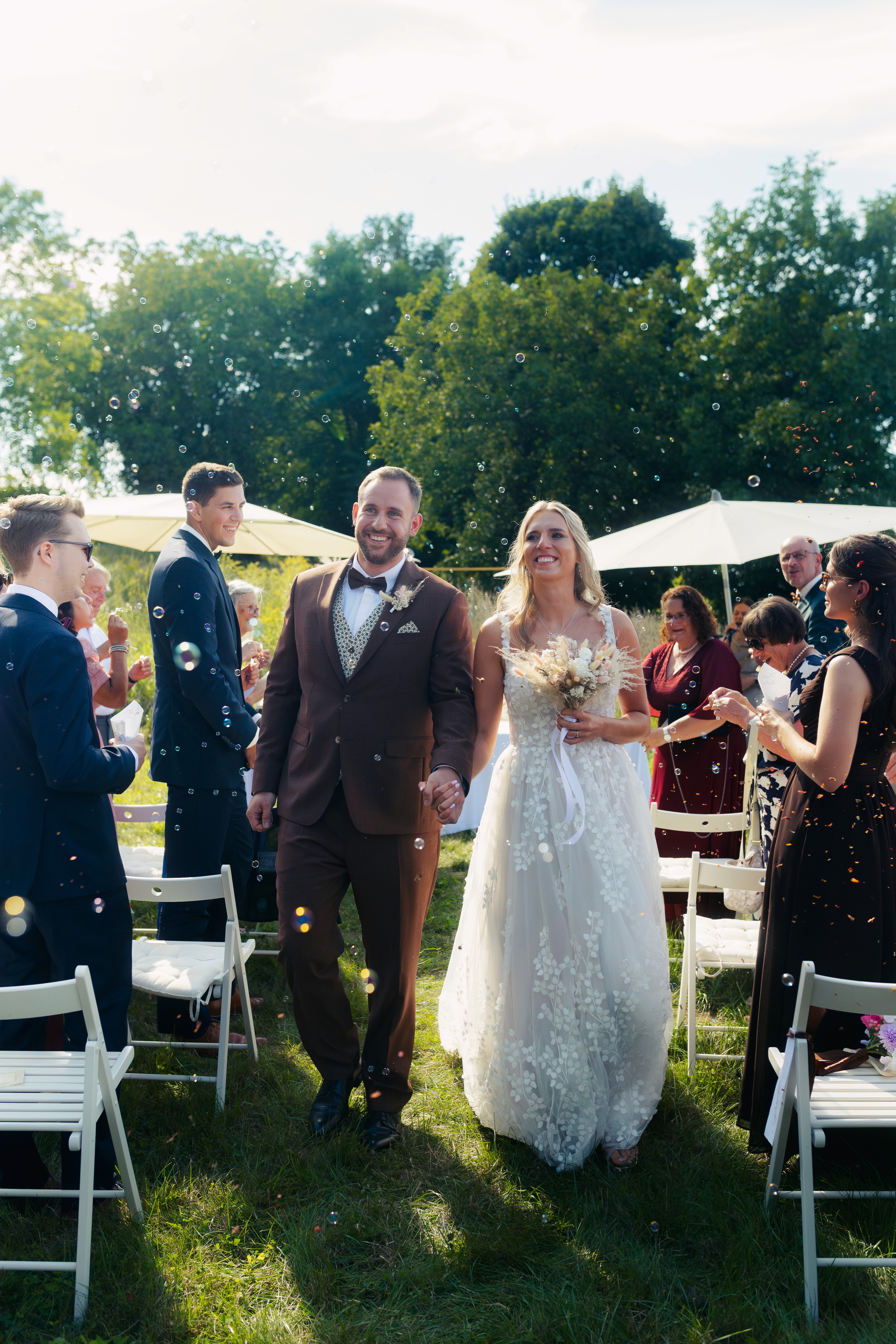 People silhouetted in foreground looking at building entrance.