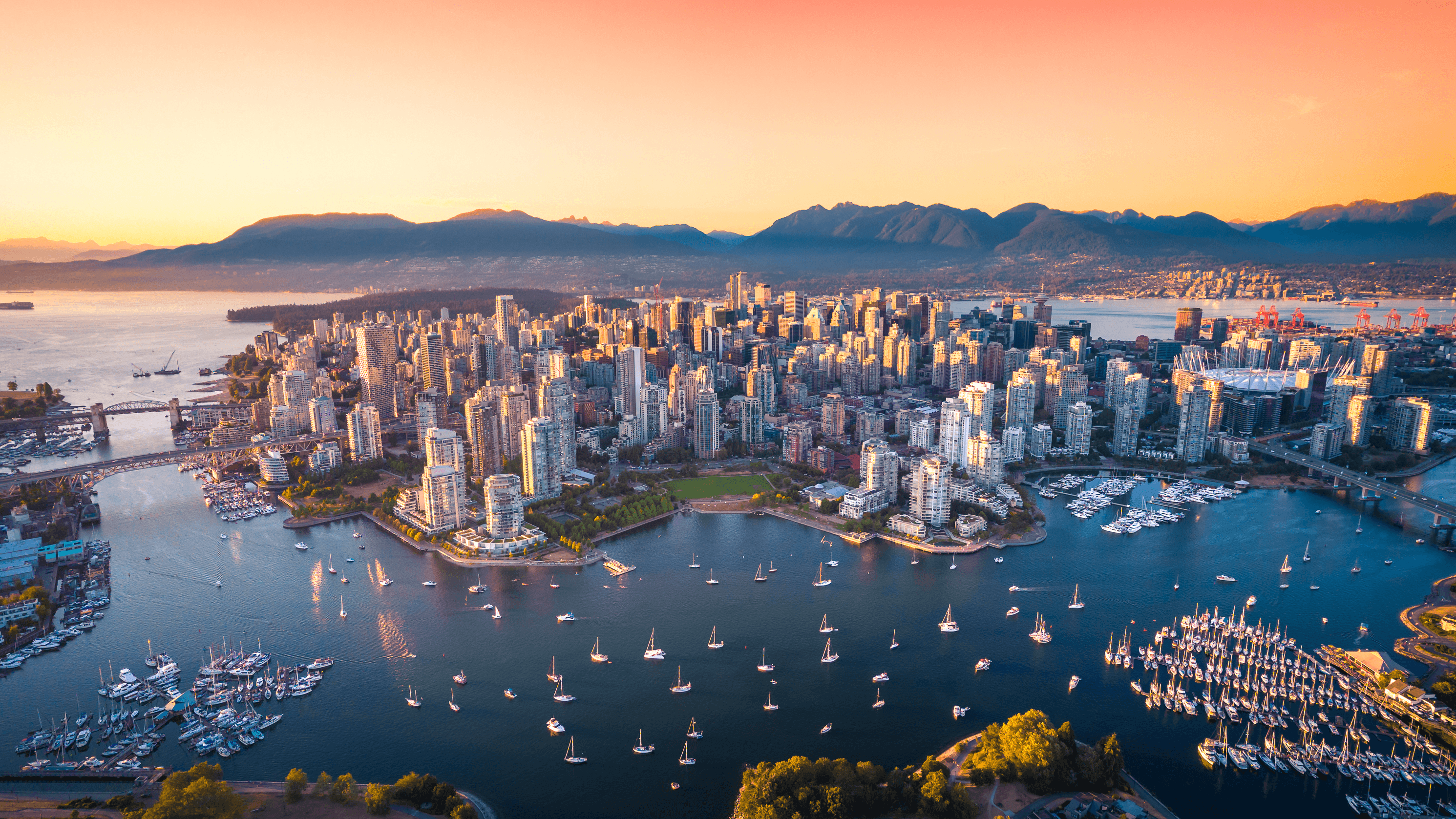 Beautiful aerial view of downtown Vancouver skyline, British Columbia, Canada at sunset.