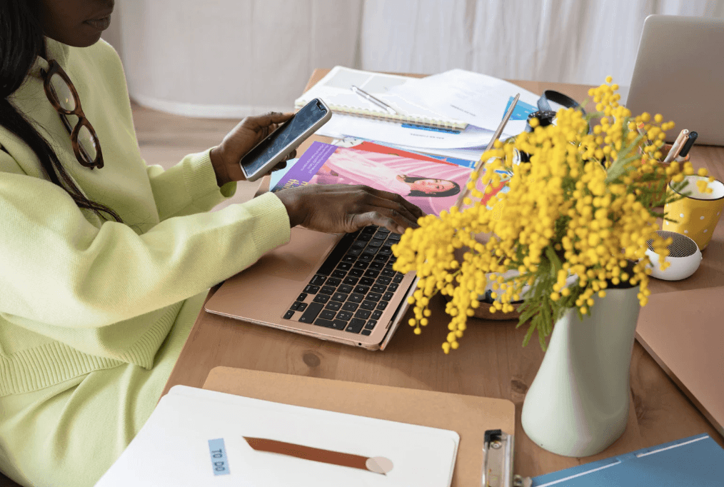 A cozy scene with warm sunlight casting stripes, featuring a potted plant and soft towels on a window sill.