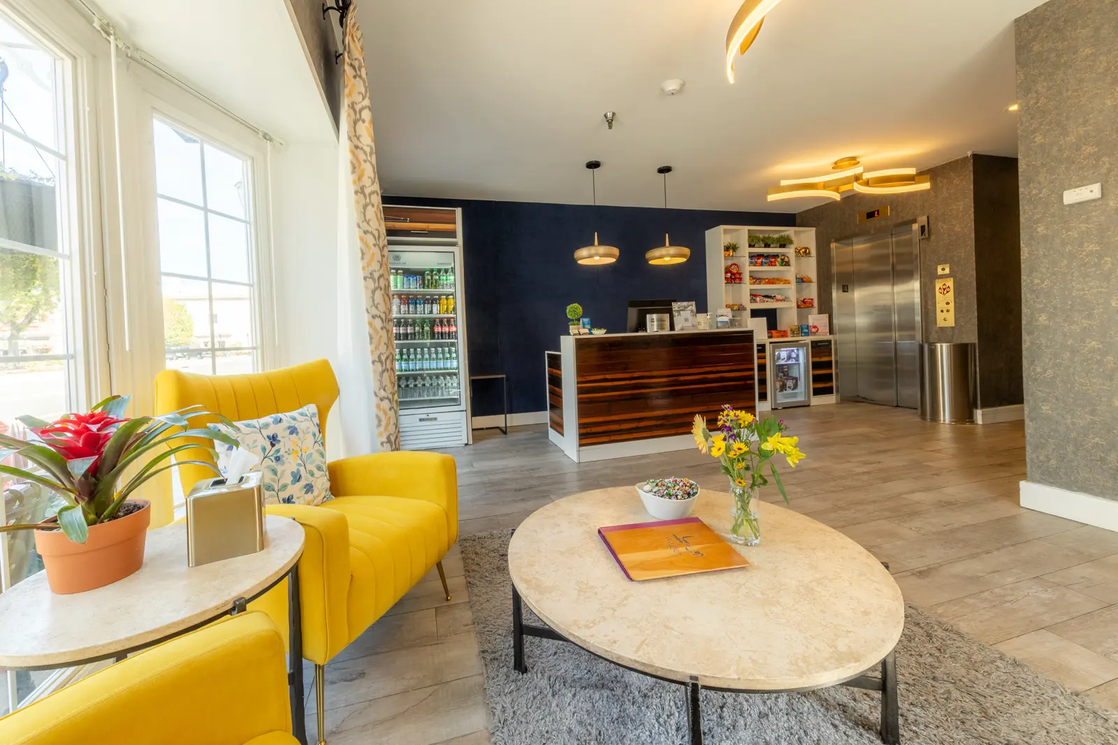Lobby area with seating, coffee table, and reception desk.