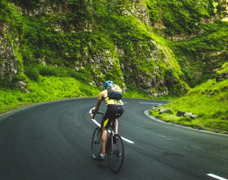 Cyclist going through mountain road