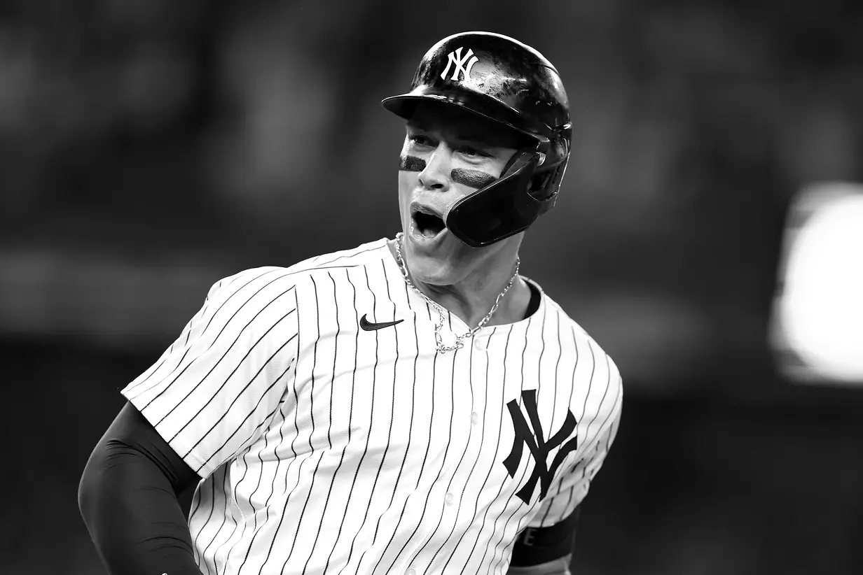 Man tending plants inside a greenhouse